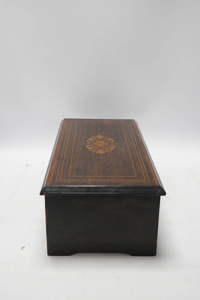A 19th century Swiss six air music box, 43cm wide. Condition - poor but working